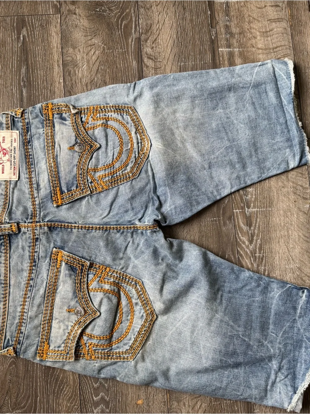 True Religion Light Wash Denim Shorts with Orange Topstitching